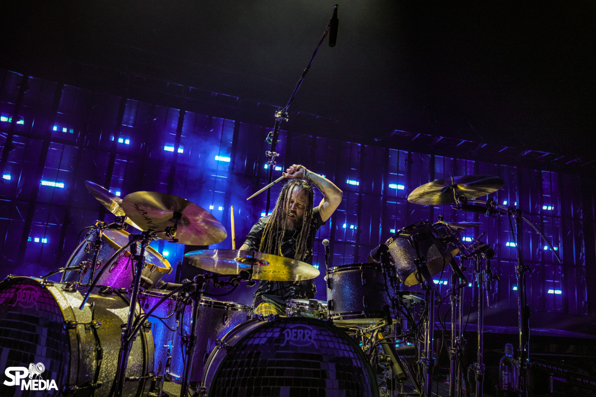 Barry Kerch behind the drum kit on stage